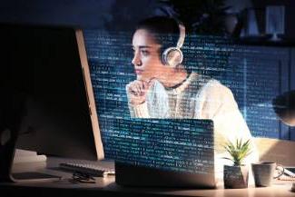 Woman analyzing computer data